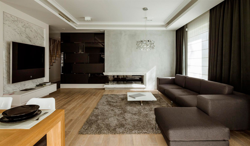 A sala de estar é minimalista como o projeto todo